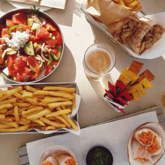 a table topped with plates of food and drinks