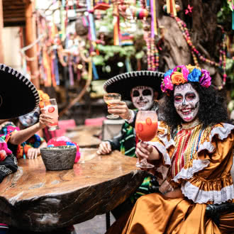 a group of people dressed in traditional mexican costumes